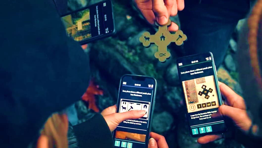 Players solving a puzzle together using smartphones and a physical clue in the Sato Code outdoor multiplayer escape game